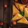 Asian food. Samsa (samosas) with chicken fillet and cheese on wooden background. Top view